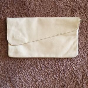 Cream colored clutch purse.